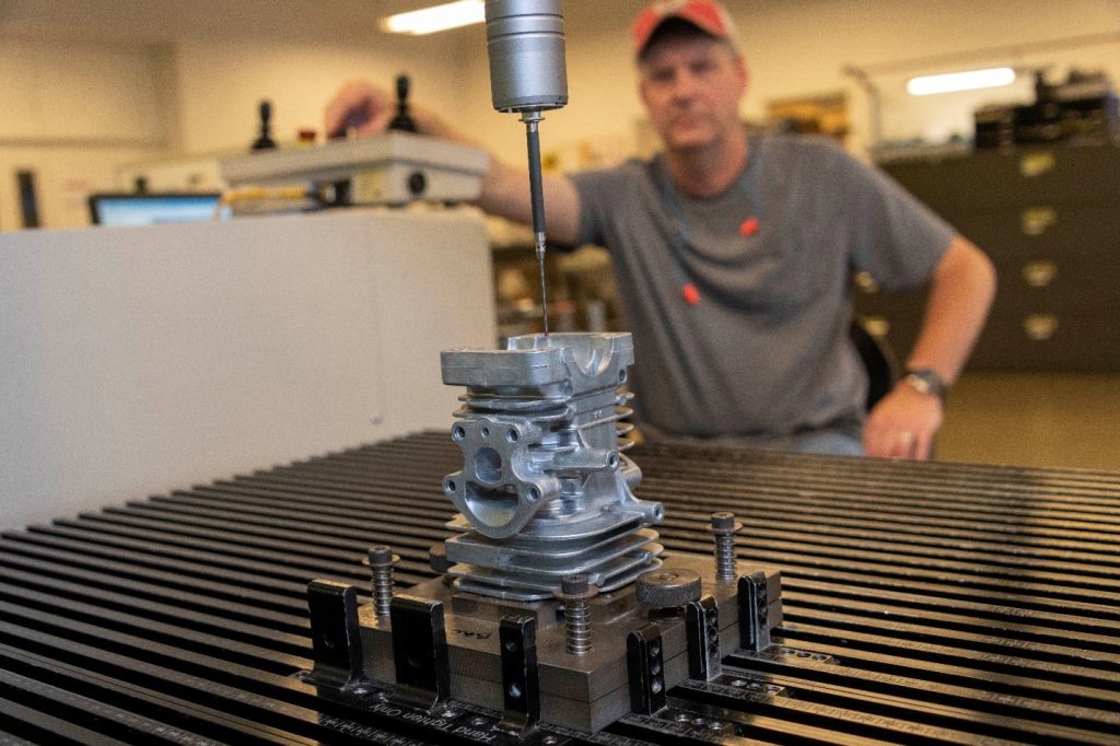 CMM inspecting a die cast part for dimensional layout